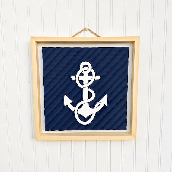 Anchor relief wall art in a natural wood frame, image 1.