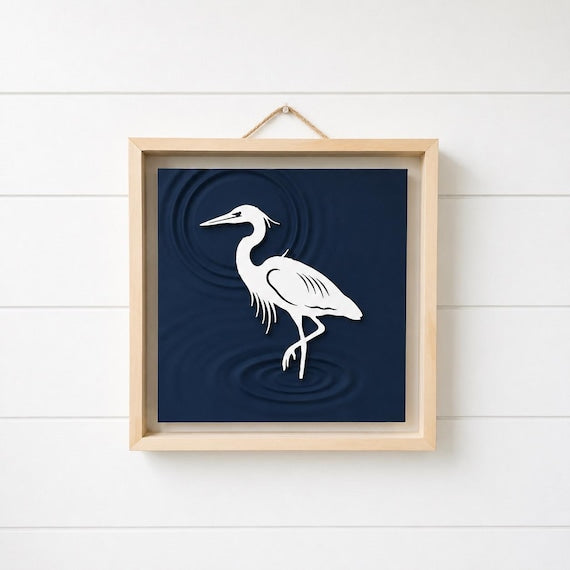 Heron relief wall art with sculpted water and a natural wood frame, image 1.