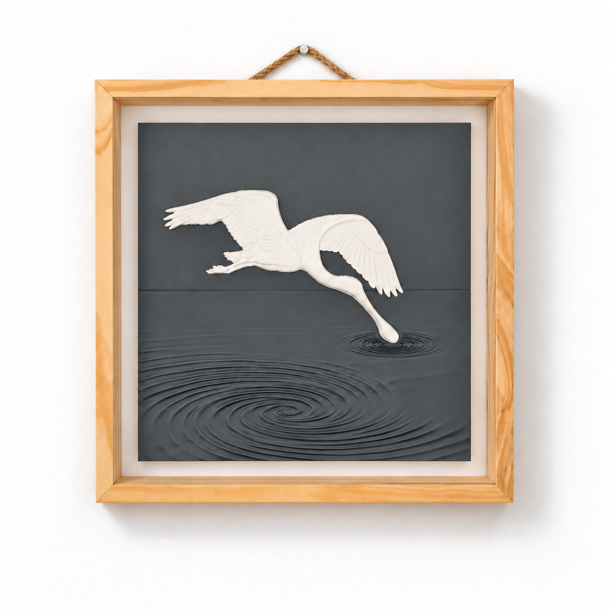 Front view of white spoonbill wall art above sculpted Charcoal water ripples in a natural wood frame — Charcoal panel