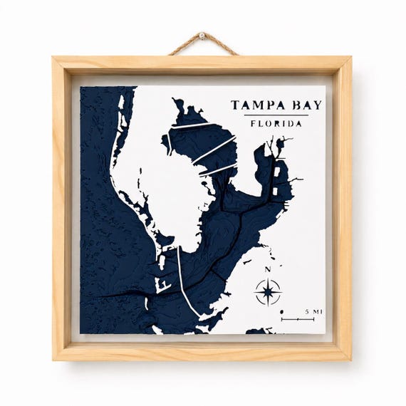 Tampa Bay bathymetric relief map in navy and white with a natural pine frame, image 1.
